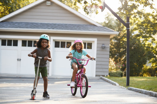 Kids playing safely in a driveway that is protected with Guardline's best driveway alarm system.